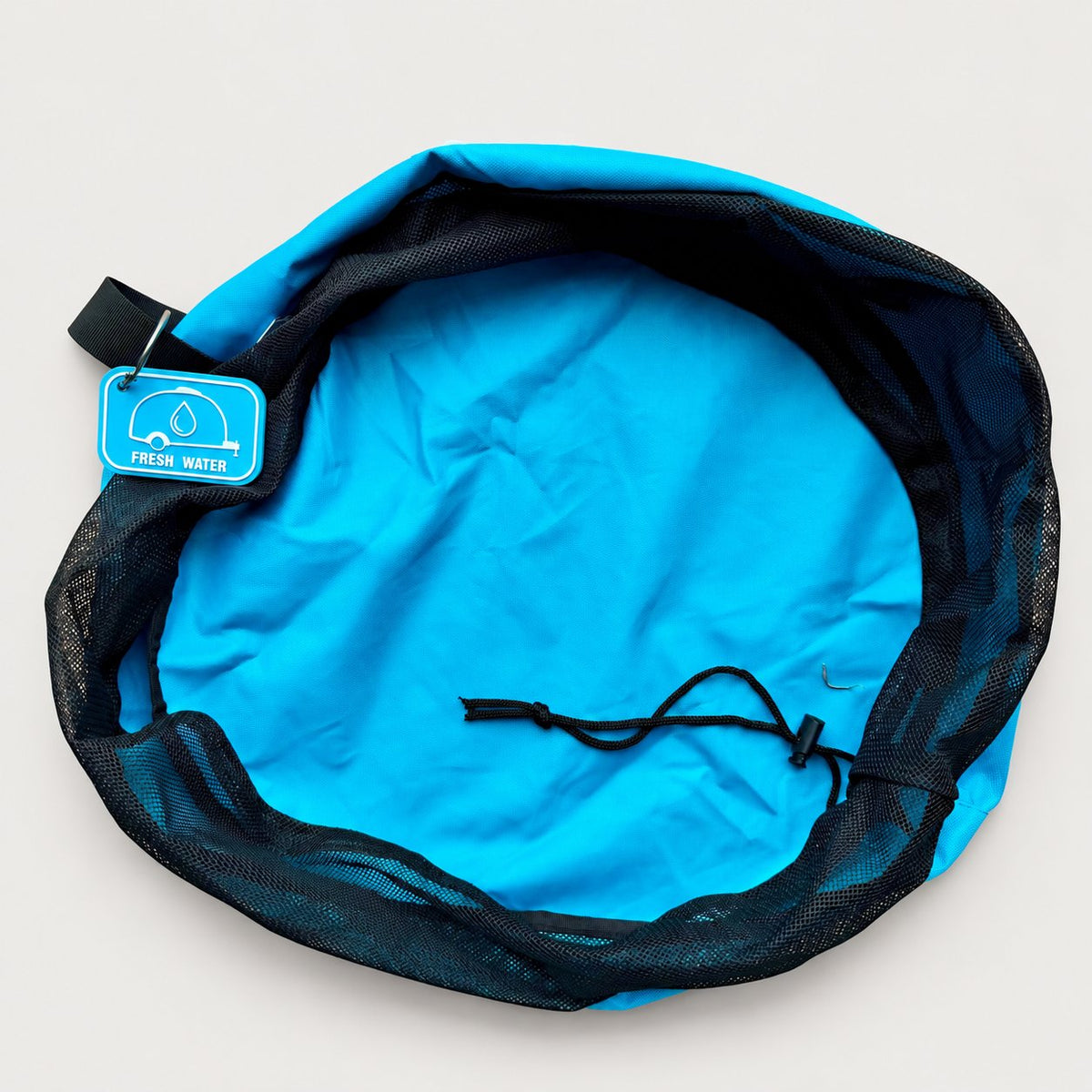 Blue drinking water hose bag open from above on a plain background, showing the mesh top, drawstring and rubber tag