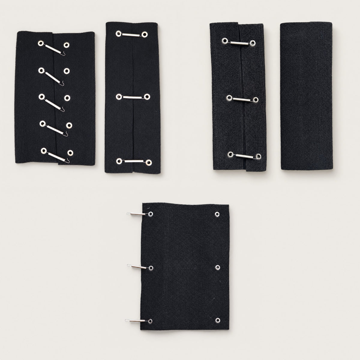 The three step rug kits laid flat: Galvanised Double Step, Aluminium Double Step and Single Step, each with its springs