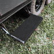 Black marine carpet step rug fitted to a single pull out caravan step