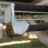 Hooking tension springs between the eyelets under a galvanised step tread