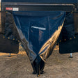 Promore Products stoneguard cover fitted over a caravan drawbar at a bush campsite in golden hour light