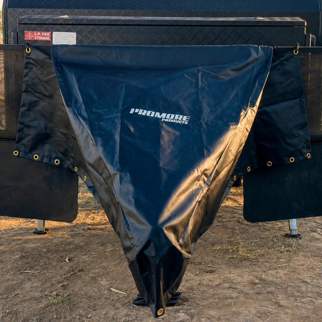 Promore Products stoneguard cover fitted over a caravan drawbar at a bush campsite in golden hour light