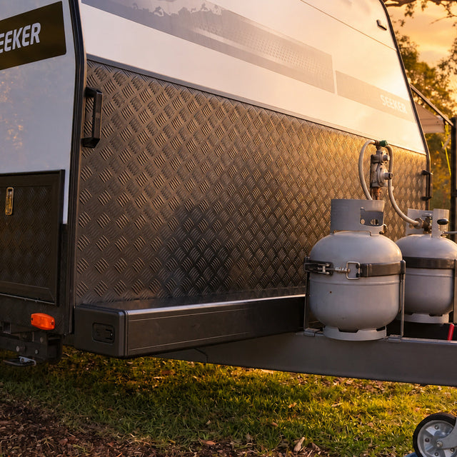 Promore Products Aluminium Caravan Pole Carrier mounted across a caravan drawbar at golden hour