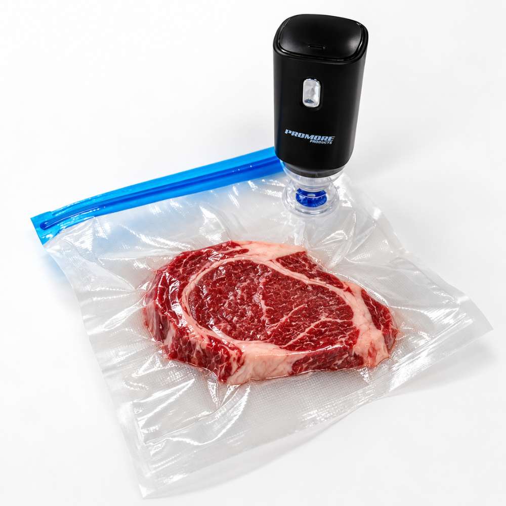 Promore Products Portable Vacuum Sealer drawing the air out of a resealable vacuum bag holding a steak