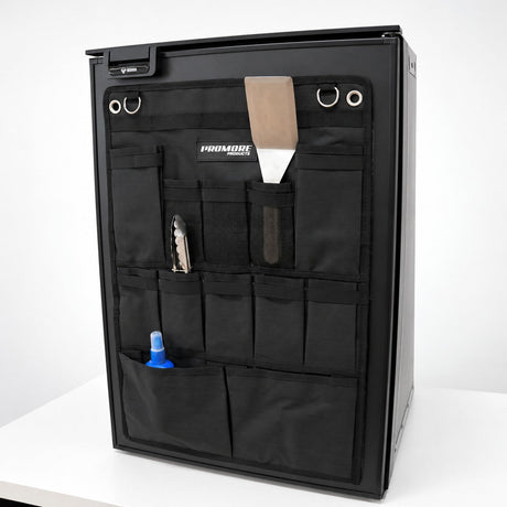 Promore Products Upright Fridge Organiser Large stuck to an upright fridge door holding tongs, a spatula and a bottle