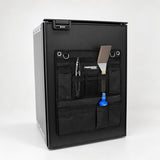 Angled view of the Promore Products Upright Fridge Organiser Small on an upright fridge door with utensils in the pockets